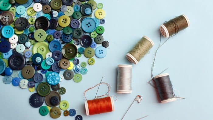 thread spool and thread on white surface