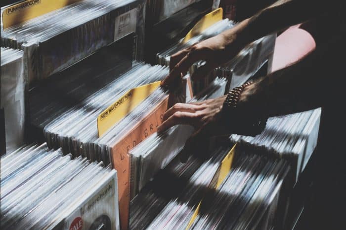 Soirée Blind test au bar "Les copains d'abord" 1 person taking photo of assorted vinyl album