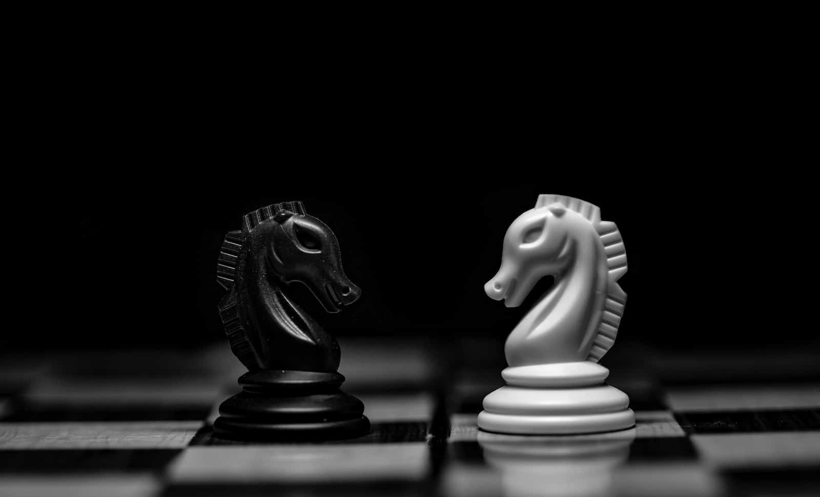 white ceramic figurine on black table