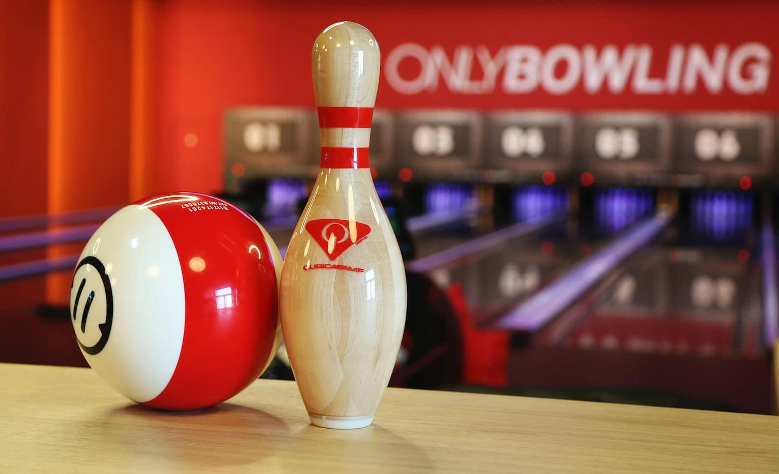 white and red coca cola print bowling pin