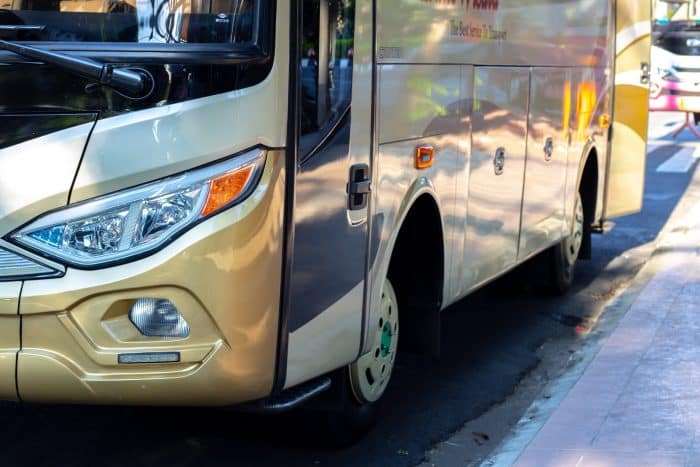 Le Roadshow de l'Assurance Maladie 1 white and brown bus